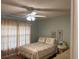 Serene bedroom with ceiling fan and window coverings at 13537 Bennett Dr, Port Charlotte, FL 33981