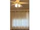 Bedroom featuring sheer curtains and ceiling fan at 13537 Bennett Dr, Port Charlotte, FL 33981
