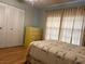 Bedroom with double closets and wood flooring at 13537 Bennett Dr, Port Charlotte, FL 33981