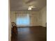 Another view of the living room with dark floors at 13537 Bennett Dr, Port Charlotte, FL 33981