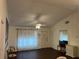 Living room with dark laminate floors and ceiling fan at 13537 Bennett Dr, Port Charlotte, FL 33981