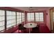 Sunroom with multiple windows and ceiling fan at 13537 Bennett Dr, Port Charlotte, FL 33981