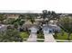 Aerial view of a house and surrounding properties in a quiet neighborhood at 1441 Strada D Oro, Venice, FL 34292