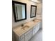 Double vanity bathroom with updated countertop and flooring at 1441 Strada D Oro, Venice, FL 34292