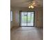 Bright bedroom with sliding glass doors to a patio at 1441 Strada D Oro, Venice, FL 34292