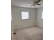Bedroom with carpeted floor, window with blinds, and ceiling fan at 1441 Strada D Oro, Venice, FL 34292