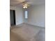 Spacious bedroom with carpeted floor and ceiling fan at 1441 Strada D Oro, Venice, FL 34292