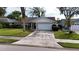 Single-story home with attached garage and well-maintained lawn at 1441 Strada D Oro, Venice, FL 34292