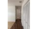 Hallway with wood-look flooring and access to bedrooms at 1441 Strada D Oro, Venice, FL 34292