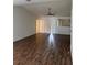 Bright living room with wood-look floors and ample natural light at 1441 Strada D Oro, Venice, FL 34292