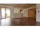 Living room with wood-look floors and access to a sunroom at 1441 Strada D Oro, Venice, FL 34292