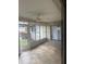 Sunroom with tiled floor and view of backyard at 1441 Strada D Oro, Venice, FL 34292