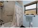 Clean bathroom with shower/tub and window at 14448 Edna Cir, Port Charlotte, FL 33981