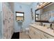 Bathroom boasts a vanity, toilet, and shower/tub combo at 14448 Edna Cir, Port Charlotte, FL 33981