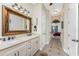 Double vanity bathroom with a view into the bedroom at 14448 Edna Cir, Port Charlotte, FL 33981