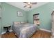Bedroom with wood floors and ceiling fan at 14448 Edna Cir, Port Charlotte, FL 33981
