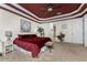 Primary bedroom with dark red ceiling, carpet, and king-size bed at 14448 Edna Cir, Port Charlotte, FL 33981