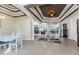 Elegant dining room with white table and chairs, near the entryway at 14448 Edna Cir, Port Charlotte, FL 33981