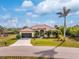 Single-story home with tile roof and attached garage at 14448 Edna Cir, Port Charlotte, FL 33981