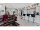 Gathering room with bar seating and views into the kitchen at 14448 Edna Cir, Port Charlotte, FL 33981
