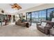 Gathering room offers stunning canal views from its multiple windows at 14448 Edna Cir, Port Charlotte, FL 33981