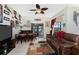 Gathering room features a wet bar and comfortable leather furniture at 14448 Edna Cir, Port Charlotte, FL 33981