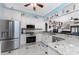 Spacious kitchen with granite countertops and stainless steel appliances at 14448 Edna Cir, Port Charlotte, FL 33981