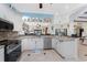 Island kitchen features granite countertops and ample cabinet space at 14448 Edna Cir, Port Charlotte, FL 33981