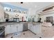 Open kitchen boasts granite counters, stainless steel appliances, and breakfast bar at 14448 Edna Cir, Port Charlotte, FL 33981
