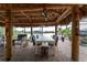 Relaxing lanai with covered patio and outdoor seating, overlooking the water at 14448 Edna Cir, Port Charlotte, FL 33981