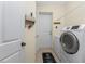 Convenient laundry room with washer, dryer, and exterior access at 14448 Edna Cir, Port Charlotte, FL 33981