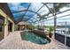 Enjoy this refreshing screened pool with gorgeous water views at 14448 Edna Cir, Port Charlotte, FL 33981