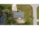 Overhead view of house, showing the roofline, yard, and driveway at 15120 Payne St, Punta Gorda, FL 33955