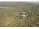 Secluded home nestled in a lush, wooded area near a lake at 15120 Payne St, Punta Gorda, FL 33955