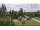 Aerial view of a single story house nestled in the trees at 15120 Payne St, Punta Gorda, FL 33955