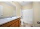 Clean bathroom with beige walls and wood vanity at 15120 Payne St, Punta Gorda, FL 33955