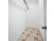 Walk-in closet with wire shelving and tile flooring at 15120 Payne St, Punta Gorda, FL 33955