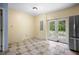 Casual dining area with tiled floors and French doors at 15120 Payne St, Punta Gorda, FL 33955
