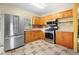 L-shaped kitchen with stainless steel appliances at 15120 Payne St, Punta Gorda, FL 33955