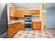 Kitchen with stainless steel appliances and wood cabinets at 15120 Payne St, Punta Gorda, FL 33955