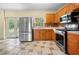Kitchen with stainless steel appliances and wood cabinets at 15120 Payne St, Punta Gorda, FL 33955