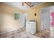 Laundry room with washer, dryer, and tile floors at 15120 Payne St, Punta Gorda, FL 33955
