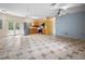 Open living room and kitchen with tiled floors at 15120 Payne St, Punta Gorda, FL 33955