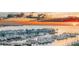 Stunning sunset over a marina filled with boats at 15120 Payne St, Punta Gorda, FL 33955