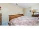 Bright bedroom featuring a comfortable bed and built-in shelving at 15180 Lyneburg Ave, Port Charlotte, FL 33981