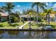 Single-story home with a canal-front view and boat lift at 15180 Lyneburg Ave, Port Charlotte, FL 33981