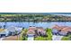 Waterfront home with a red door and a private dock, offering scenic views of the surrounding canal at 15361 Visalia Rd, Port Charlotte, FL 33981
