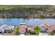 Waterfront home with a red door and a private dock, offering scenic views of the surrounding canal at 15361 Visalia Rd, Port Charlotte, FL 33981