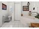 Guest bathroom with toilet, tub and linen closet at 15361 Visalia Rd, Port Charlotte, FL 33981