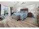 Main bedroom with wood-look floors and access to a balcony at 15361 Visalia Rd, Port Charlotte, FL 33981